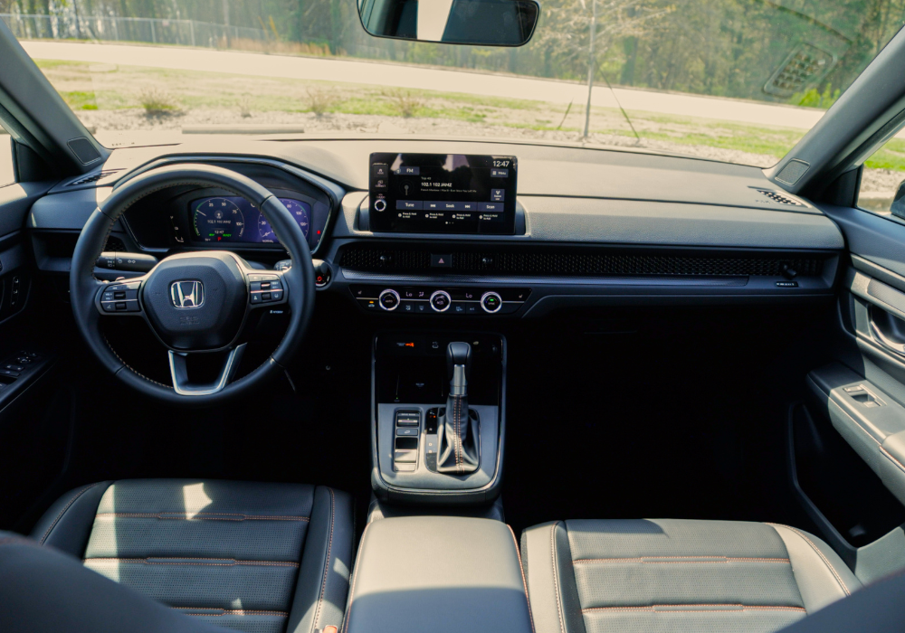 Interior of the Honda CR-V Hybrid Sport-L, showing the entire front dash of the SUV
